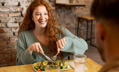 Smiley woman and man at restaurant