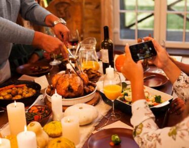 Man cutting turkey on the table