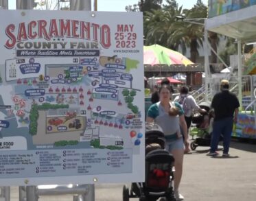 Signpost detailing the Sacramento County Fair map and events for May 2023