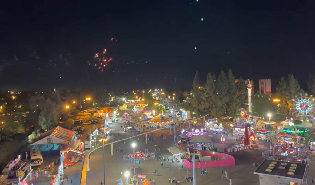 Night view of the Sacramento Fair 2022, alive with lights and fireworks